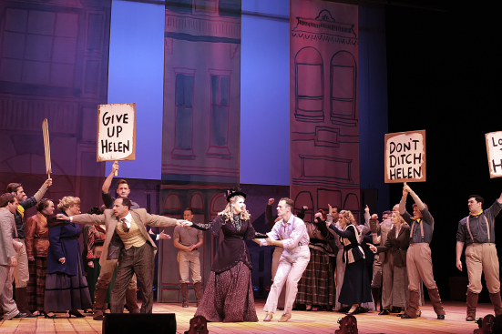 Foreground: Menelaus(Andy baldwin) fights over Helen (Danielle Estes) with Paris (Hayden Clifton)