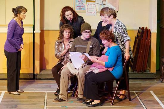 The brazen ladies plotting their photo shoot with shy photographer Lawrence (Michael McCray)